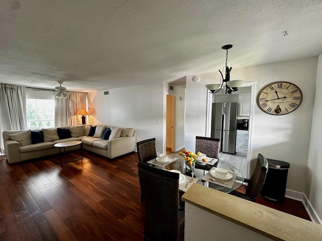 148 Yacht Club Dr Unit 13, North Palm Beach, FL 33408 - living area featuring wood finished floors, a textured ceiling, and a chandelier
