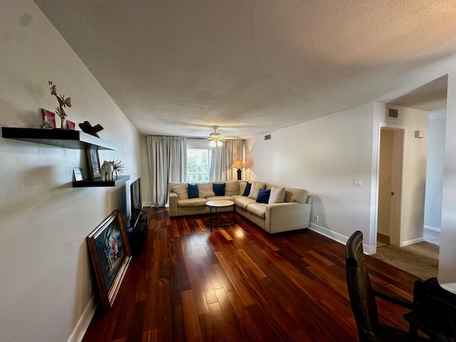 148 Yacht Club Dr Unit 13, North Palm Beach, FL 33408 - living area with dark wood-style flooring, a textured ceiling, and a ceiling fan