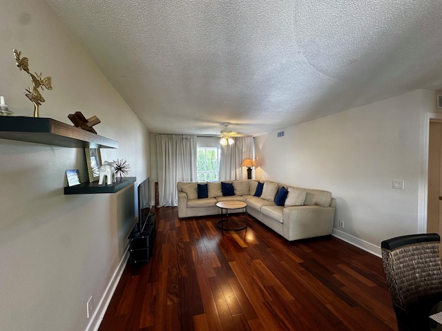 148 Yacht Club Dr Unit 13, North Palm Beach, FL 33408 - living area featuring a textured ceiling, dark wood finished floors, and a ceiling fan