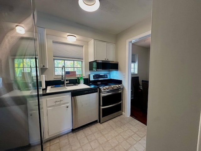 148 Yacht Club Dr Unit 13, North Palm Beach, FL 33408 - kitchen with stainless steel appliances and white cabinets