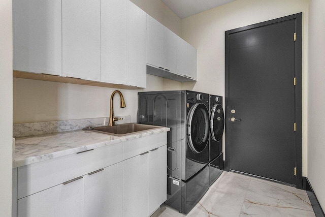13480 US Highway 1, Juno Beach, FL 33408 - laundry area with washing machine and dryer, cabinet space, and light marble finish flooring