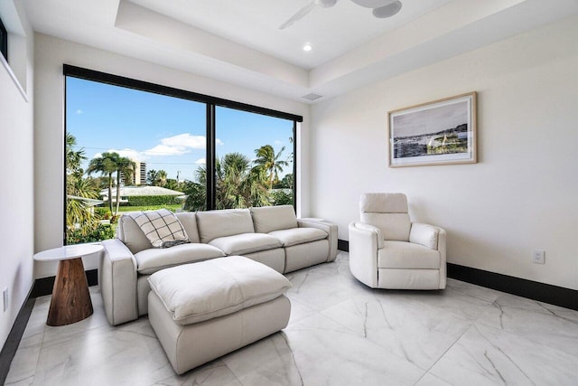 13480 US Highway 1, Juno Beach, FL 33408 - living room featuring ceiling fan, light marble finish flooring, a raised ceiling, and recessed lighting