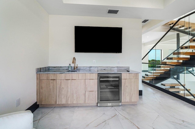 13480 US Highway 1, Juno Beach, FL 33408 - indoor wet bar with wine cooler, stairs, and light marble finish floors