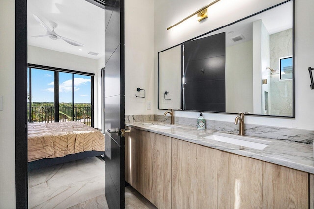 13480 US Highway 1, Juno Beach, FL 33408 - bathroom featuring marble tiled flooring, double vanity, and ensuite bathroom