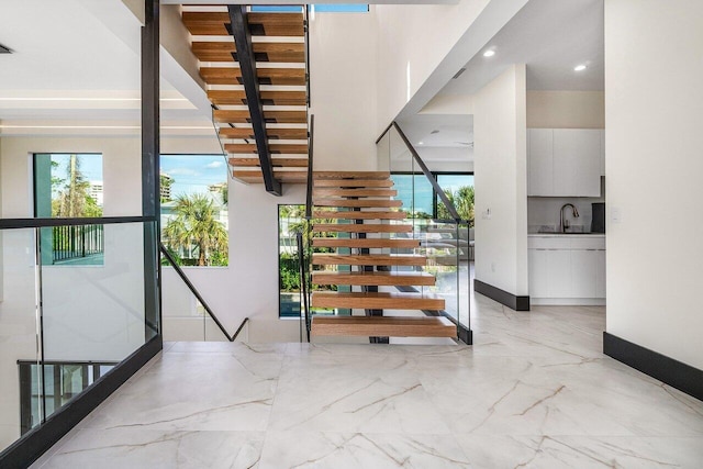13480 US Highway 1, Juno Beach, FL 33408 - stairway featuring marble tiled flooring and recessed lighting