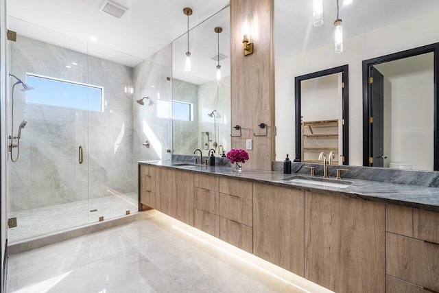 13480 US Highway 1, Juno Beach, FL 33408 - full bathroom featuring double vanity, a marble finish shower, and a spacious closet