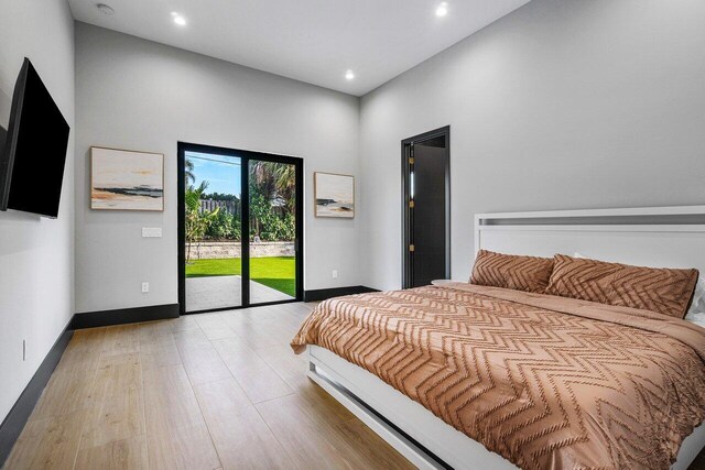 13480 US Highway 1, Juno Beach, FL 33408 - bedroom featuring access to outside, recessed lighting, and light wood finished floors