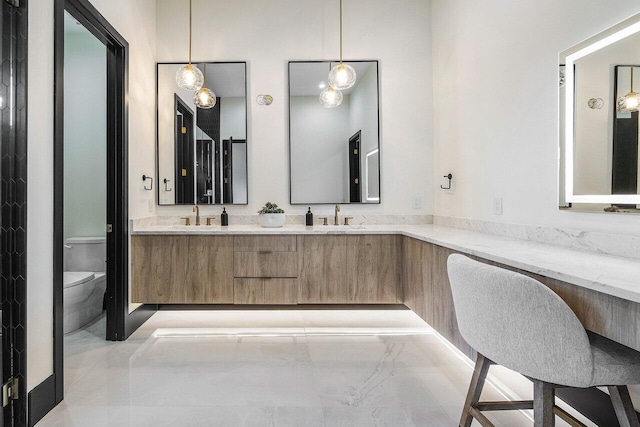 13480 US Highway 1, Juno Beach, FL 33408 - bathroom featuring double vanity and marble finish flooring