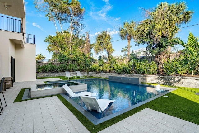 13480 US Highway 1, Juno Beach, FL 33408 - view of swimming pool with a fenced backyard, a patio area, and a pool with connected hot tub