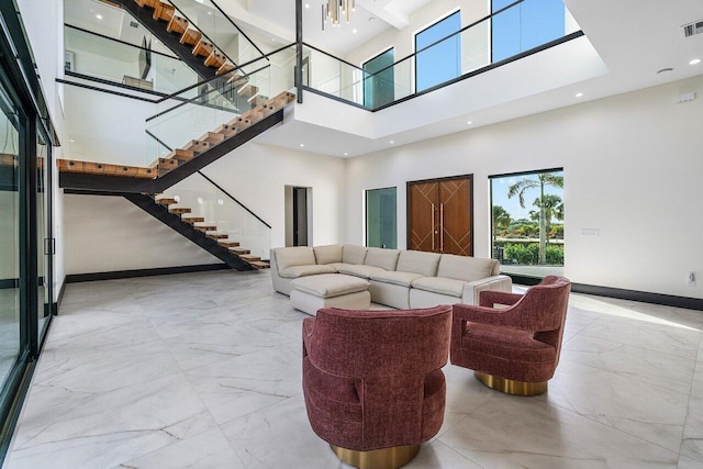 13480 US Highway 1, Juno Beach, FL 33408 - living area featuring a high ceiling, marble finish floors, stairway, and recessed lighting