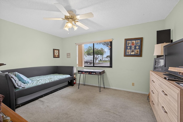 2640 Gately Dr W Unit 1604, West Palm Beach, FL 33415 - bedroom featuring light carpet, ceiling fan, and a textured ceiling