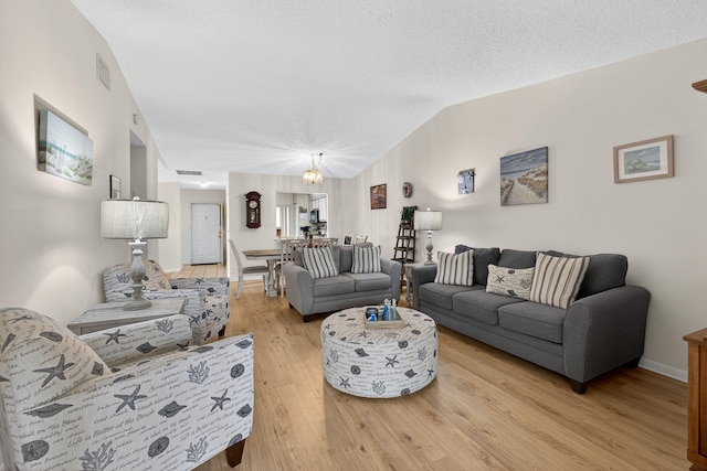 2640 Gately Dr W Unit 1604, West Palm Beach, FL 33415 - living room featuring light wood finished floors and lofted ceiling