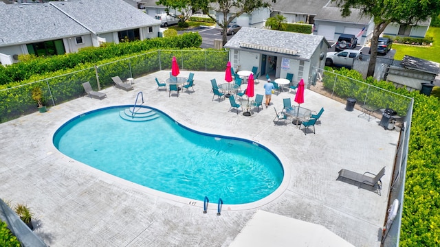 2640 Gately Dr W Unit 1604, West Palm Beach, FL 33415 - community pool with a patio area and a residential view
