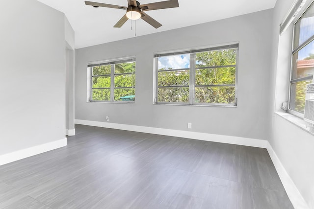 7609 NW 70th Ave, Tamarac, FL 33321 - empty room with plenty of natural light and ceiling fan