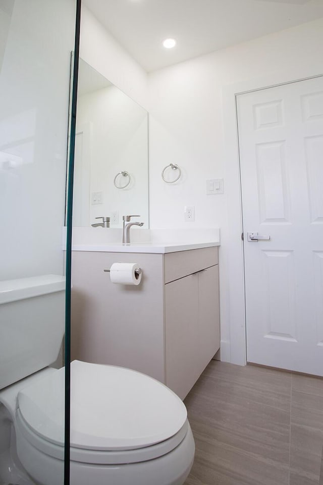 7609 NW 70th Ave, Tamarac, FL 33321 - bathroom with vanity, wood finished floors, and recessed lighting