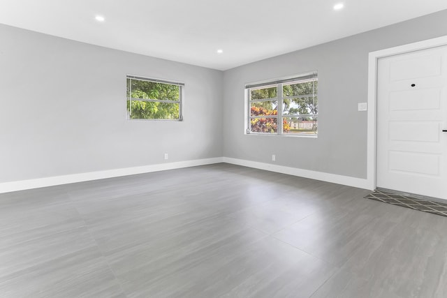 7609 NW 70th Ave, Tamarac, FL 33321 - empty room featuring baseboards and recessed lighting