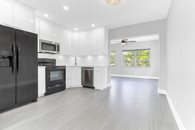 7609 NW 70th Ave, Tamarac, FL 33321 - kitchen featuring black appliances, modern cabinets, white cabinets, a ceiling fan, and light countertops