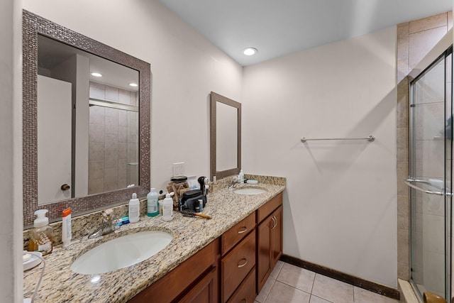 5310 Pebble Beach Dr Unit F, Orlando, FL 32811 - bathroom with a stall shower, double vanity, and tile patterned flooring