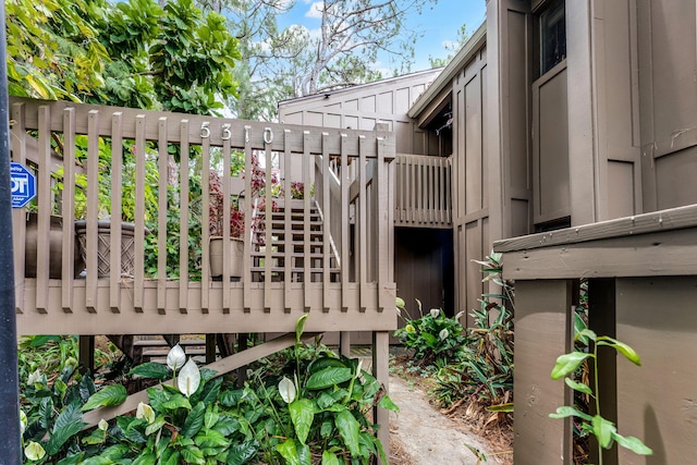 5310 Pebble Beach Dr Unit F, Orlando, FL 32811 - view of property exterior featuring stairway and board and batten siding