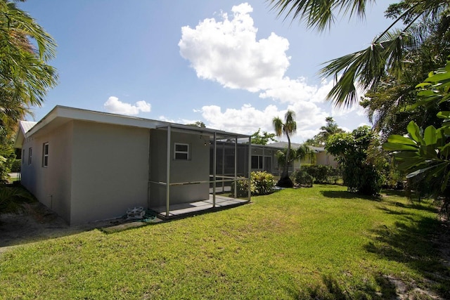 8 Wellesley Dr, Lake Worth Beach, FL 33460 - view of grassy yard with a lanai