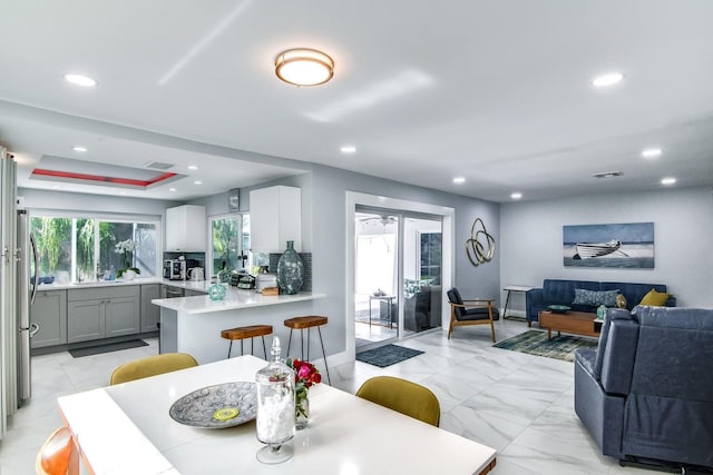 8 Wellesley Dr, Lake Worth Beach, FL 33460 - dining area featuring recessed lighting and light marble finish flooring
