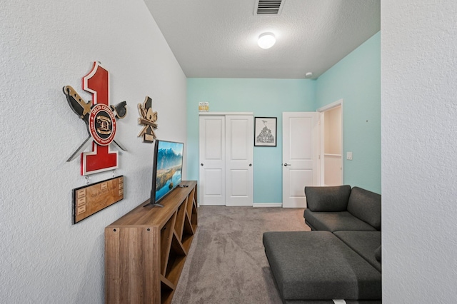 2808 Troubadour St, Palm Springs, FL 33406 - sitting room featuring carpet flooring, a textured ceiling, and a textured wall