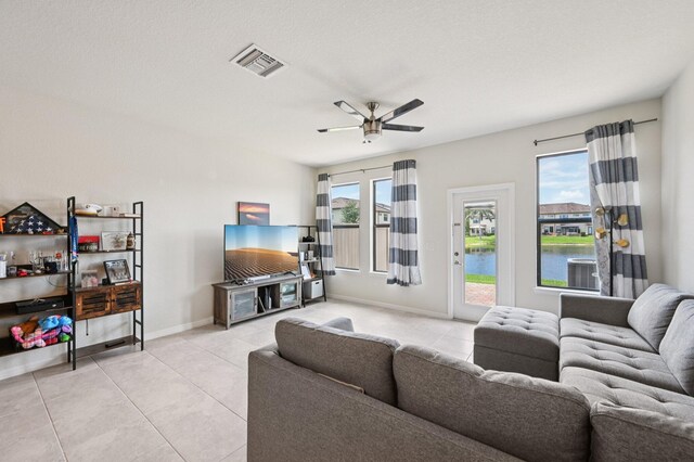 2808 Troubadour St, Palm Springs, FL 33406 - tiled living room featuring a ceiling fan and baseboards