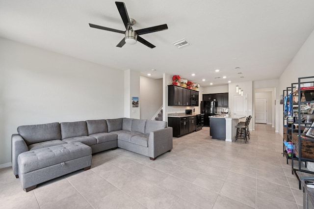 2808 Troubadour St, Palm Springs, FL 33406 - living area with light tile patterned floors, ceiling fan, recessed lighting, and stairs