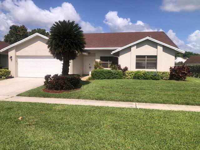7992 Chula Vista Cres, Boca Raton, FL 33433 - single story home featuring an attached garage, stucco siding, concrete driveway, and a front lawn