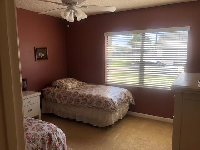 7992 Chula Vista Cres, Boca Raton, FL 33433 - bedroom with light carpet, ceiling fan, and a textured ceiling