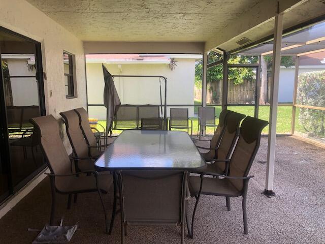 7992 Chula Vista Cres, Boca Raton, FL 33433 - sunroom / solarium featuring outdoor dining area