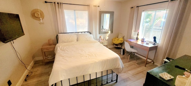 440 NE 1st Ave, Fort Lauderdale, FL 33301 - bedroom featuring light wood finished floors and baseboards