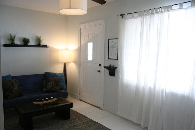 440 NE 1st Ave, Fort Lauderdale, FL 33301 - living area featuring light tile patterned floors and ceiling fan