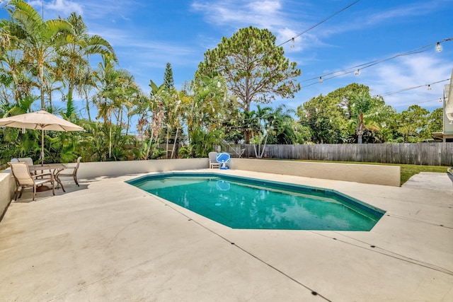 1234 SE Petunia Ave, Port Saint Lucie, FL 34952 - view of pool with a patio and a fenced backyard
