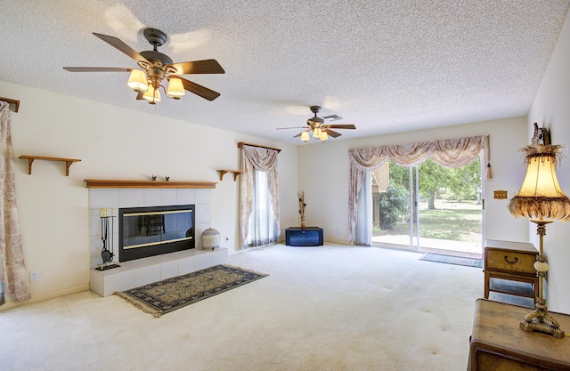 5176 Palm Way N, Lake Worth, FL 33463 - unfurnished living room featuring a textured ceiling, carpet flooring, plenty of natural light, and a ceiling fan