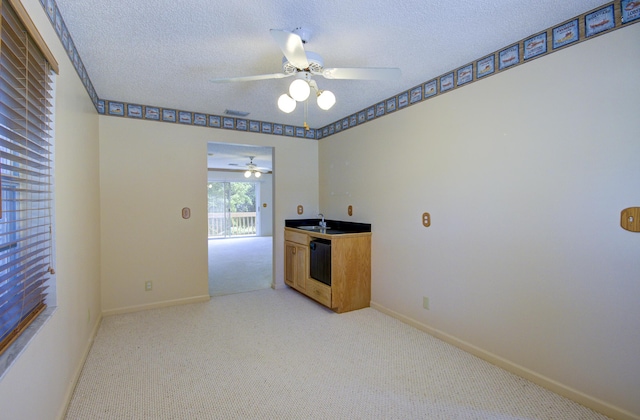 5176 Palm Way N, Lake Worth, FL 33463 - unfurnished room featuring ceiling fan, light carpet, and a textured ceiling