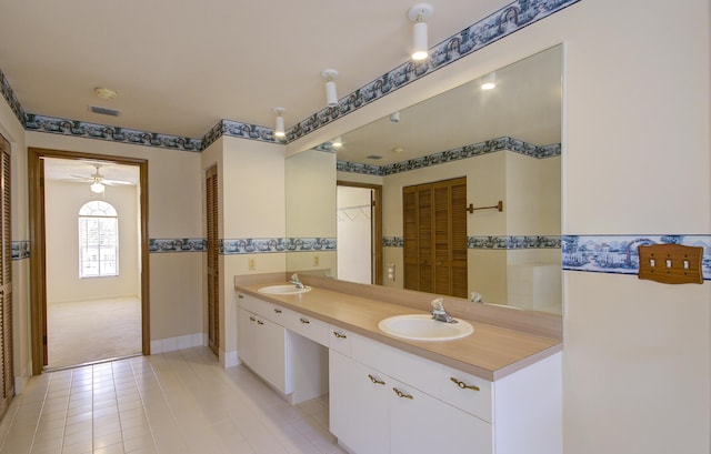 5176 Palm Way N, Lake Worth, FL 33463 - bathroom with double vanity, tile patterned floors, and ceiling fan