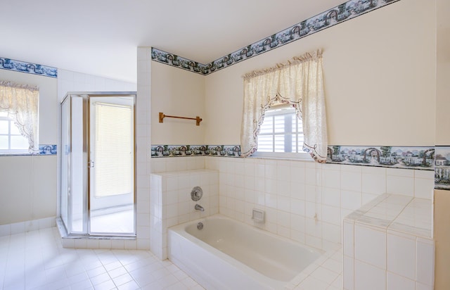 5176 Palm Way N, Lake Worth, FL 33463 - bathroom with healthy amount of natural light, a garden tub, tile patterned flooring, a shower stall, and a wainscoted wall