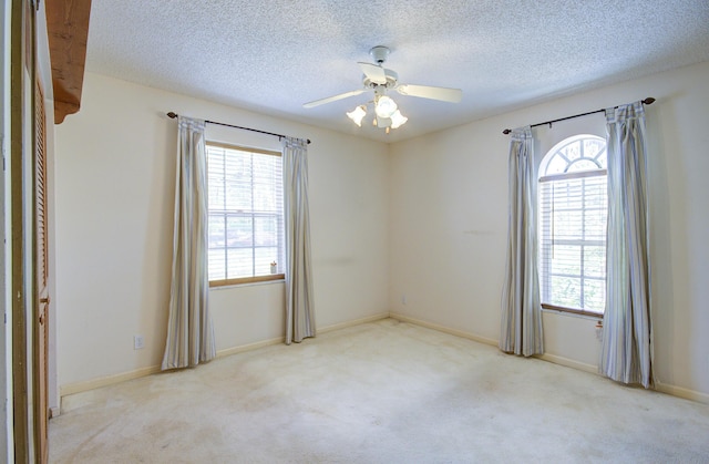 5176 Palm Way N, Lake Worth, FL 33463 - carpeted spare room featuring a textured ceiling and ceiling fan