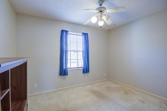 5176 Palm Way N, Lake Worth, FL 33463 - carpeted empty room featuring a textured ceiling and a ceiling fan