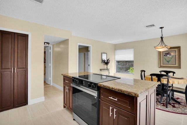 6526 Sweet Maple Ln, Boca Raton, FL 33433 - kitchen with range with electric cooktop, a textured ceiling, hanging light fixtures, light stone countertops, and a center island