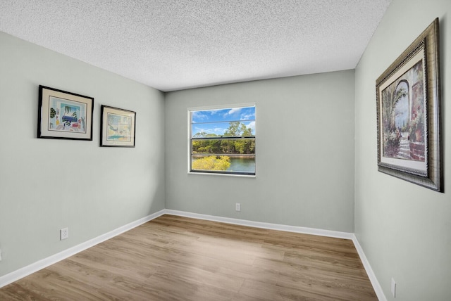 6526 Sweet Maple Ln, Boca Raton, FL 33433 - unfurnished room with wood finished floors and a textured ceiling