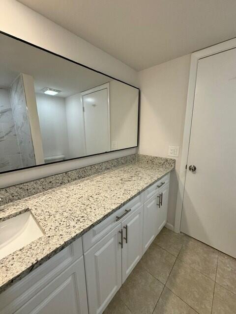 3822 38th Way, West Palm Beach, FL 33407 - full bathroom featuring double vanity and tile patterned floors