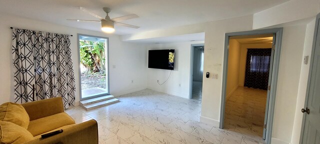 104 NE 5th St, Fort Lauderdale, FL 33301 - unfurnished room with light marble finish floors and ceiling fan