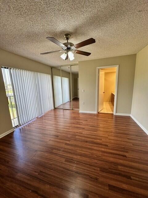 3819 38th Way, West Palm Beach, FL 33407 - empty room featuring wood finished floors, a ceiling fan, and a textured ceiling