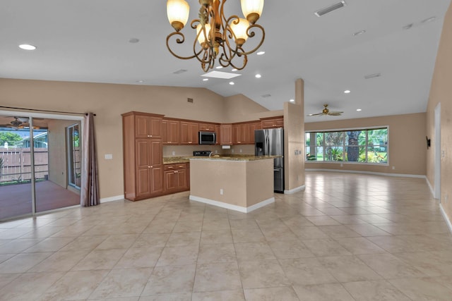 1070 SW Jennifer Ter, Port Saint Lucie, FL 34953 - kitchen with stainless steel appliances, open floor plan, recessed lighting, a center island, and light tile patterned flooring
