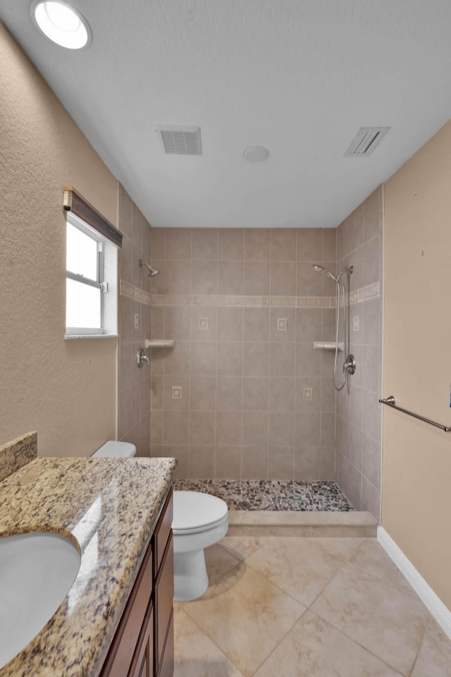 1070 SW Jennifer Ter, Port Saint Lucie, FL 34953 - bathroom featuring vanity and a tile shower