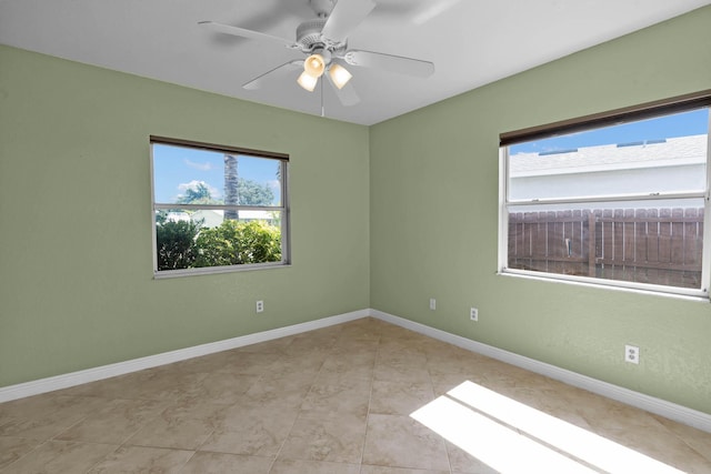 1070 SW Jennifer Ter, Port Saint Lucie, FL 34953 - empty room with a ceiling fan and light tile patterned floors