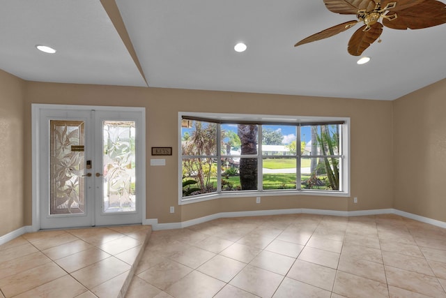 1070 SW Jennifer Ter, Port Saint Lucie, FL 34953 - entryway featuring french doors, light tile patterned flooring, ceiling fan, and recessed lighting