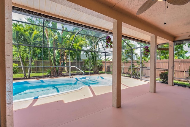 1070 SW Jennifer Ter, Port Saint Lucie, FL 34953 - view of pool with a fenced backyard, a patio area, glass enclosure, and a ceiling fan